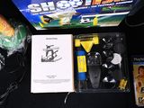a box with a game controller and other items on a table