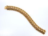 an image of a gold bracelet on a white background