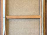a close up of a picture of a window frame on a wall