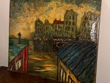 a painting of a cityscape on a wooden table