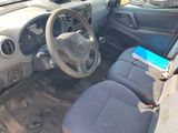 a car that has a laptop in the passenger seat