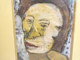 a painting of a man that is on the wall