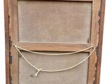 an old wooden frame with a rope hanging from it ' s side