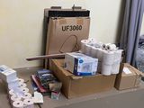 many rolls of toilet paper sitting on a table in a room