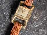 an image of a wrist watch on a stone surface