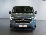 the front view of a blue van parked in a showroom
