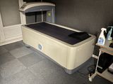 an image of a room with a bed and a table