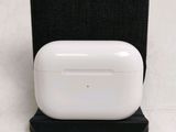 an apple airpods are sitting on top of a black stand