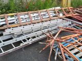 a pile of metal and wood on the side of the road