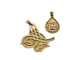a close up of two gold pendants with arabic writing on them
