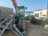 a tractor that is sitting on the side of the road