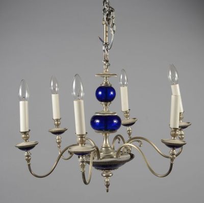 an image of a chandelier with five candles and a blue glass ball