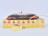 a toy car that is sitting on top of a ruler