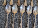 a lot of spoons that are sitting on a table