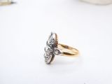 an image of a gold and silver ring on a white surface