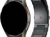 a close up of a metal bracelet with a black watch face