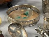 a table with a lot of silver items on it
