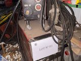 a machine that is sitting on top of a pile of junk