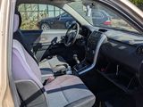 a car that is parked in the lot with its door open