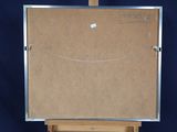 an easel with a piece of cardboard on top of it on a blue background