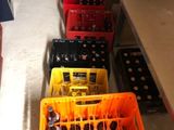 several crates of beer are lined up on a shelf in a room