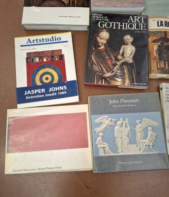 several books are sitting on a table next to each other