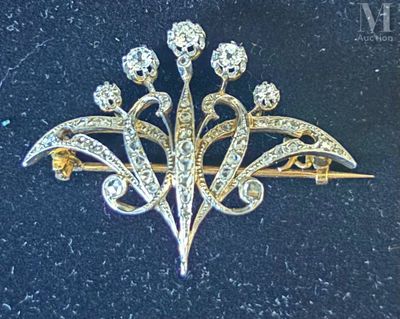 a brooch with a bunch of diamonds on it