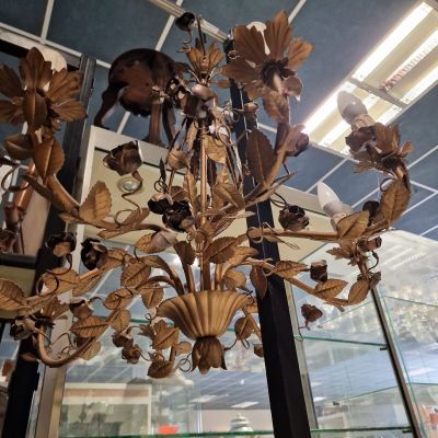 a chandelier made of wood and glass in a store