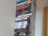 a tall stack of dvd ' s sitting on a shelf