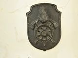 a metal plaque on the wall of a building