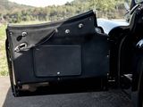 a close up of a black car door with a black handlebar