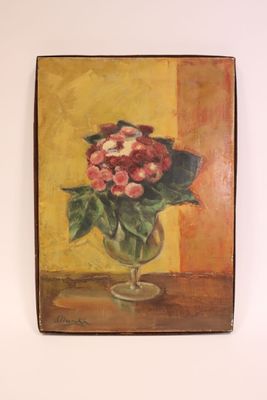 un tableau de fleurs dans un vase sur le mur