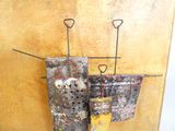 a painting hanging on the wall with a pair of scissors