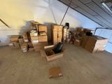a room full of boxes and a chair in the middle of the room