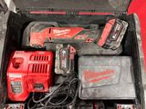 a tool box with tools in it on a red surface