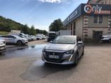 the silver car is parked in front of a building with many cars parked in front of it