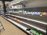 many shelves in the store with various products on them