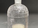 a bottle of perfume sitting on top of a table