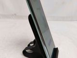 a cell phone that is sitting on a stand