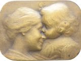an image of a bronze plaque of a mother and child