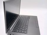a laptop computer that is sitting on a white surface