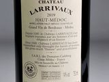 a bottle of wine that is sitting on a table