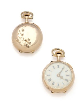 two gold pocket watches with roman numerals and roman numerals on them