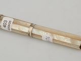 a close up of a glass tube with a label on it