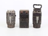 three different types of old metal items on a white surface