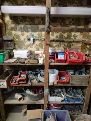 a room with a shelf full of assorted items