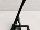 a close up of a tablet computer on a stand on a table