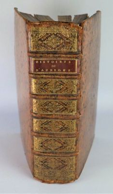 an old book that is sitting on top of a table