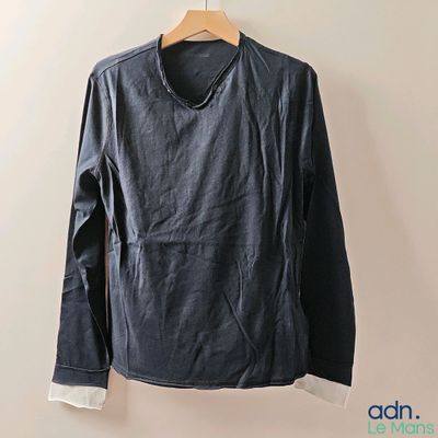 an image of a black leather jacket hanging on a hanger