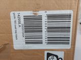 the back of a brown box with a barcode on the side of it